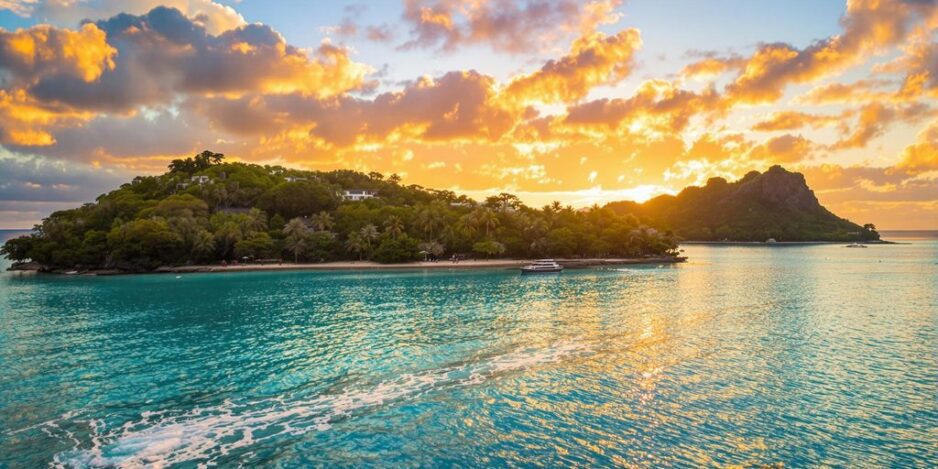 Tropical cruise with lush islands and turquoise waters.