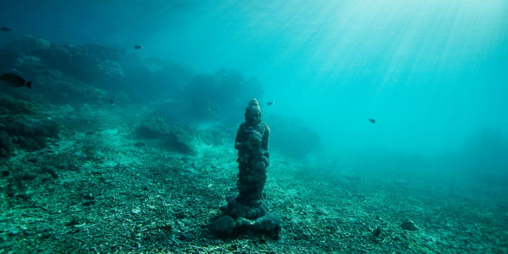 statue under ocean water