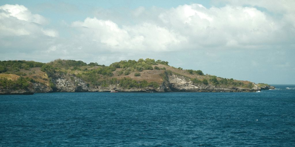 A small island in the middle of a body of water
